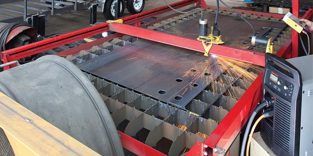What is a CNC plasma table used for?